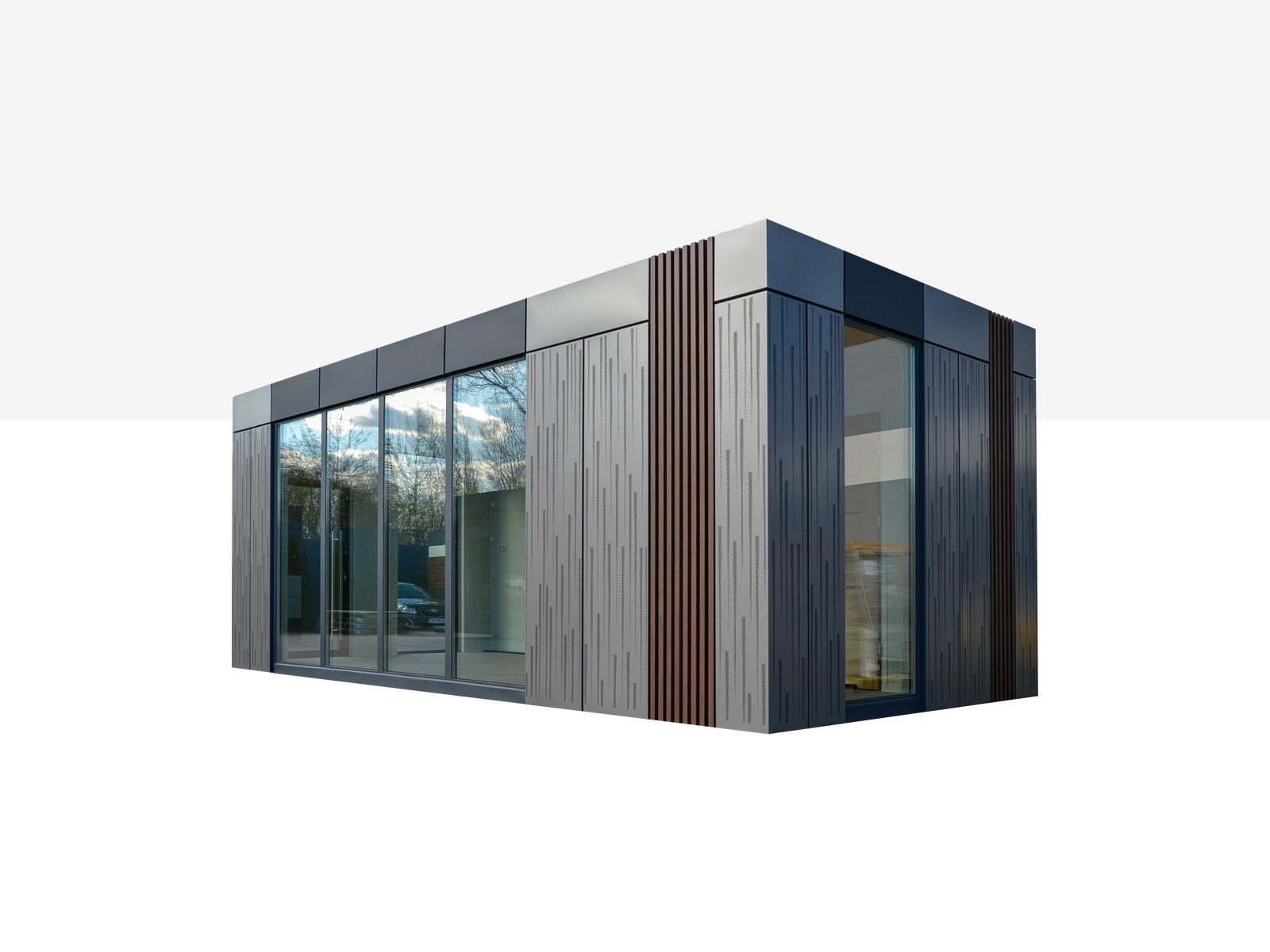 Modernes, eingeschossiges Modulgebäude mit großer Glasfront und grauer Metallfassade mit vertikalen Designelementen