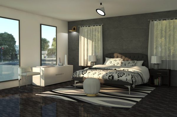 Modernes Schlafzimmer in einem Containerhaus mit großem Bett, Designteppich und Tageslicht